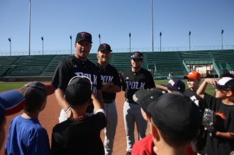 clinic1 Polk State Baseball Head Coach Al Corbeil and players Conor Szczerba and Colt Hankamer (L-R) instruct children on making double-plays during the 12th-annual JuCo Youth Clinic on Thursday in Grand Junction, Colo.